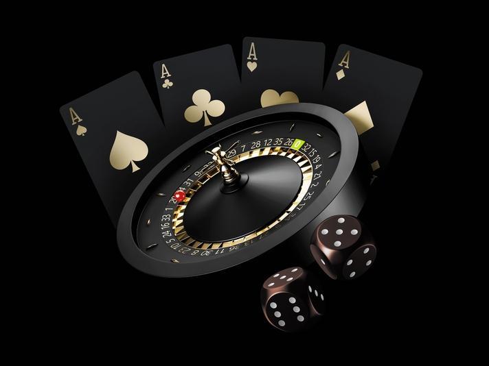 Una reproducción en 3D de una ruleta de casino, cartas y un dado.